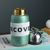 Titanium covered insulated cup